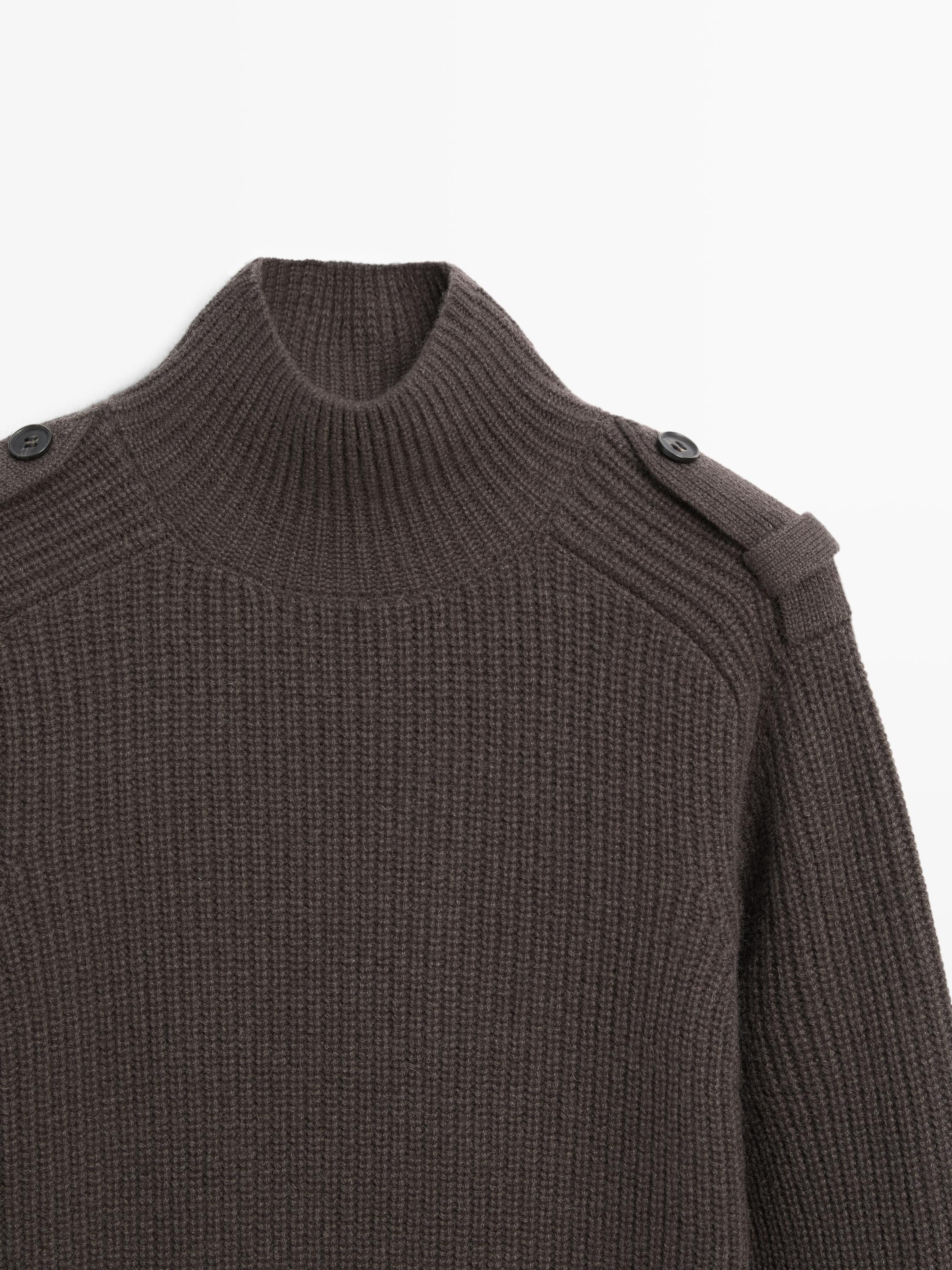 Knit sweater with shoulder detail